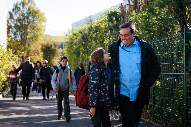 students and parents arriving at the school