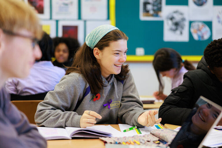 student smiling in the classroom